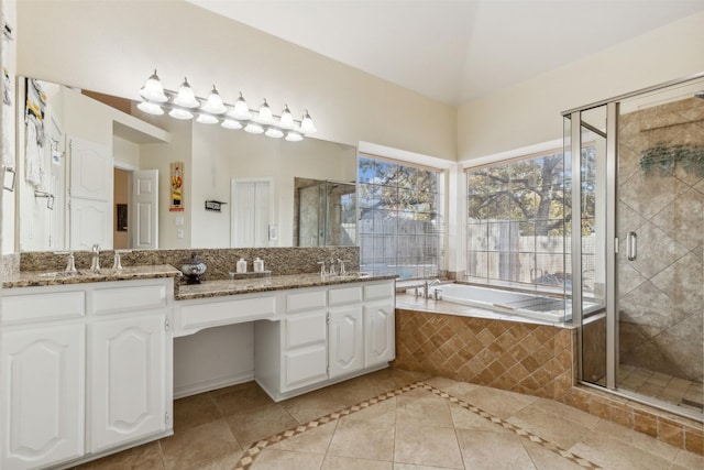 bathroom featuring tile patterned flooring, vanity, and separate shower and tub