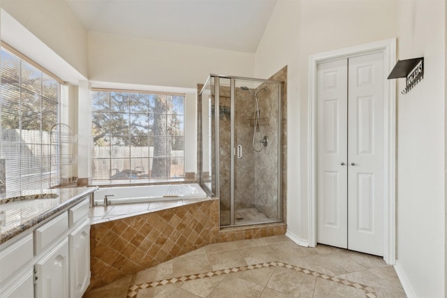 bathroom with separate shower and tub, tile patterned flooring, and vanity