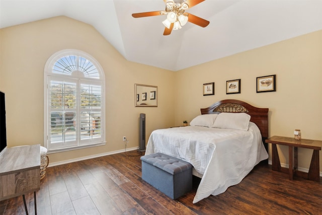 bedroom featuring ceiling fan, dark hardwood / wood-style flooring, and lofted ceiling