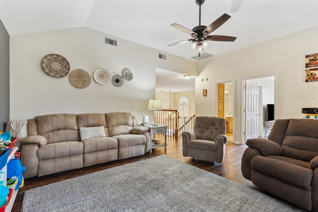 living room featuring ceiling fan, dark hardwood / wood-style flooring, and lofted ceiling