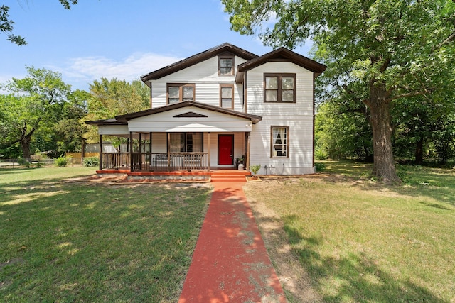 view of front of house featuring covered porch and a front lawn