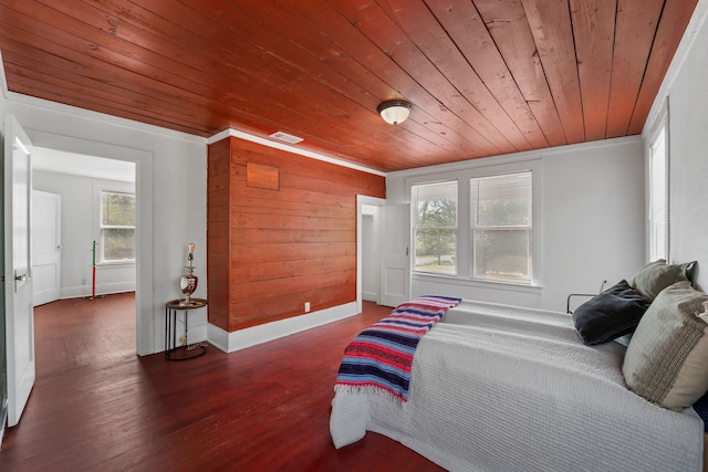 bedroom with wood ceiling, wood walls, dark wood-type flooring, and ornamental molding