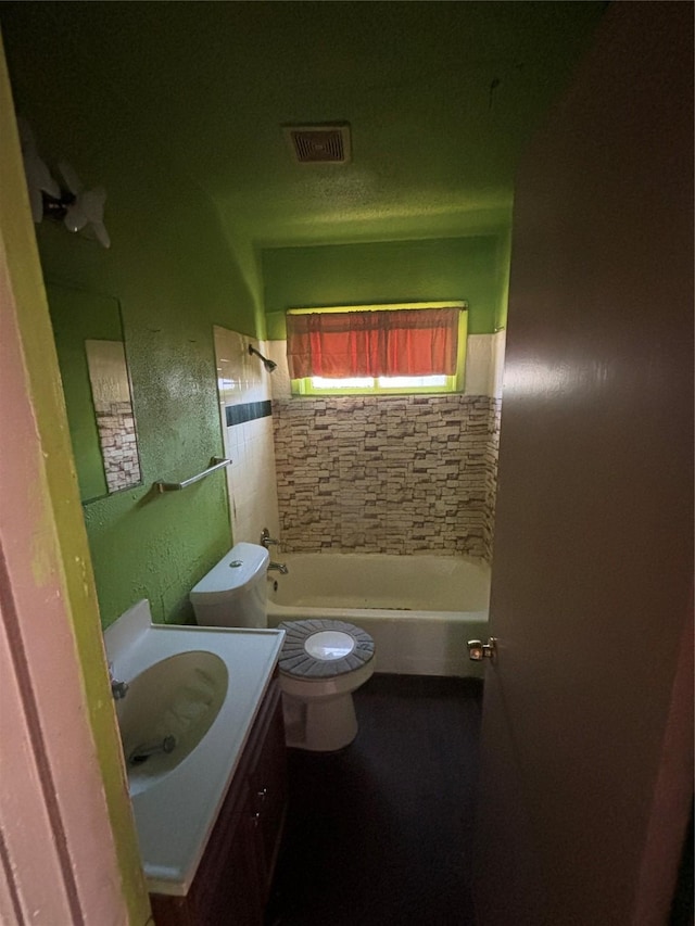 4848 Haas Dr, Dallas, TX 75216 - full bathroom with tiled shower / bath, vanity, and toilet