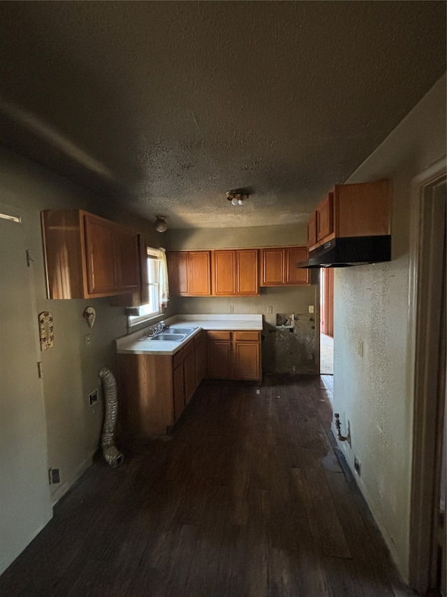4848 Haas Dr, Dallas, TX 75216 - kitchen with dark wood-type flooring, sink, and a textured ceiling