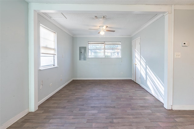 unfurnished room featuring hardwood / wood-style floors, a wealth of natural light, electric panel, and a textured ceiling