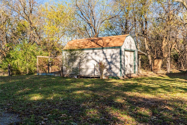 view of outdoor structure with a lawn