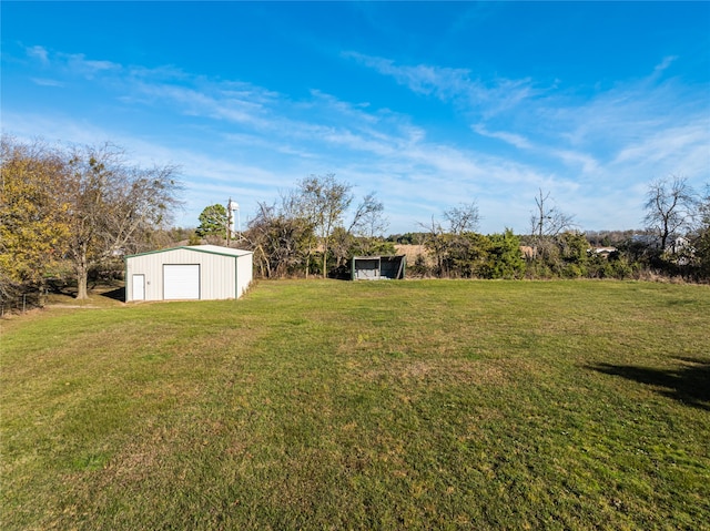 view of yard with an outbuilding and a garage