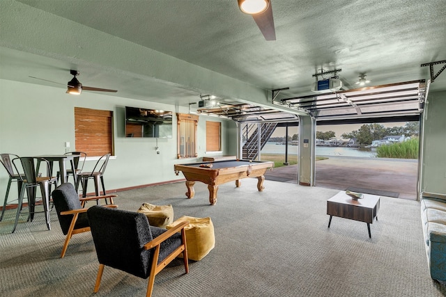 game room featuring carpet flooring, a water view, plenty of natural light, and billiards