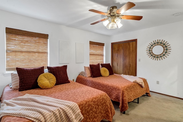 carpeted bedroom with ceiling fan