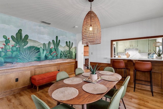 dining space featuring light wood-type flooring