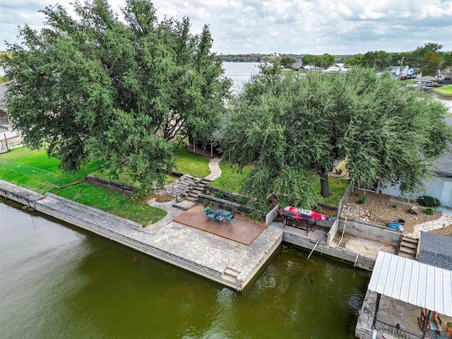 view of dock with a water view and a patio