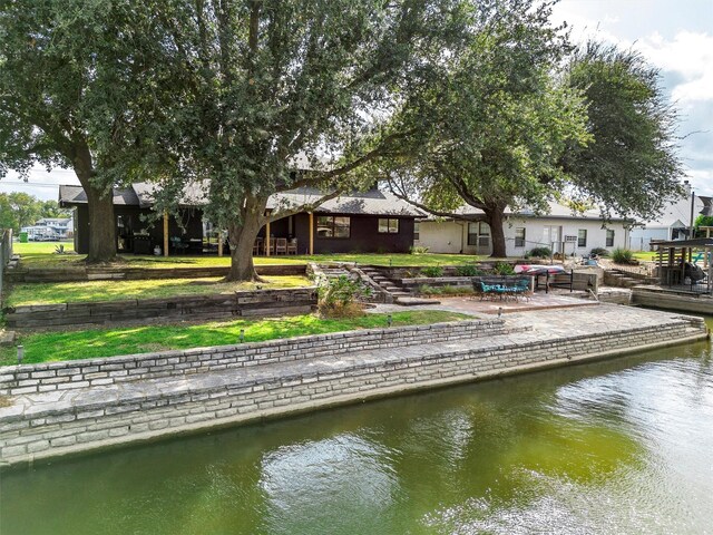 exterior space with a water view