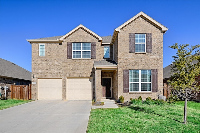 view of front of house with a garage and a front yard