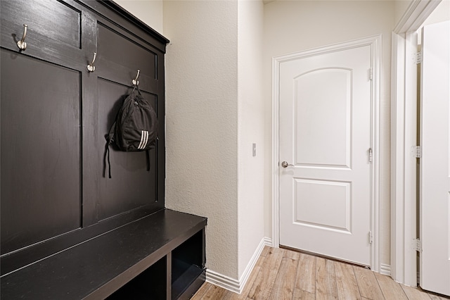 mudroom with light hardwood / wood-style flooring