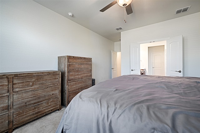 carpeted bedroom featuring ceiling fan and vaulted ceiling