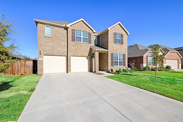 view of front of property with a front yard and a garage