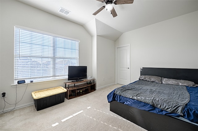 carpeted bedroom featuring ceiling fan and vaulted ceiling