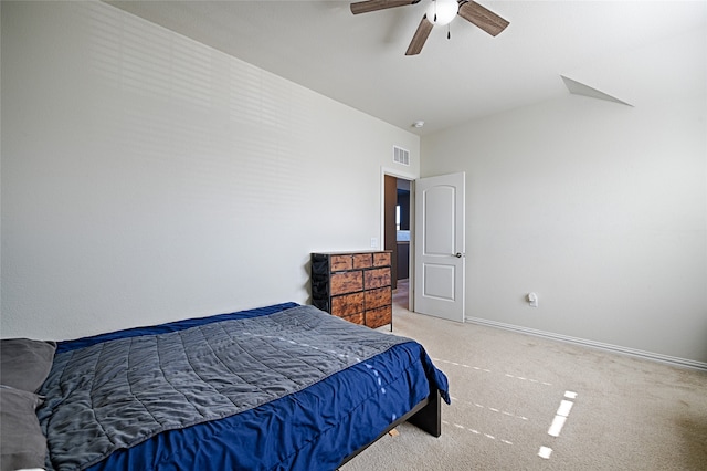 bedroom with ceiling fan and light colored carpet