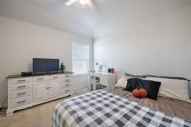 bedroom with ceiling fan, light carpet, and vaulted ceiling