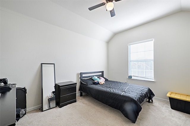 carpeted bedroom with ceiling fan and lofted ceiling