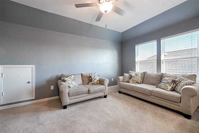 carpeted living room featuring ceiling fan