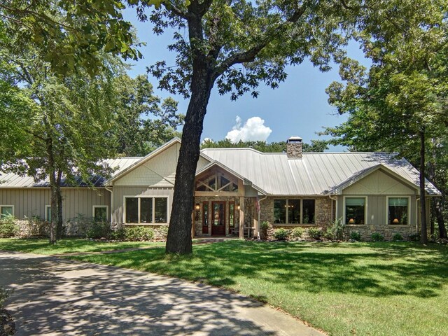 view of side of property with a lawn