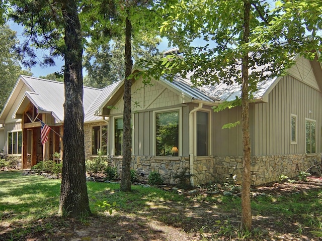 view of property exterior with a lawn