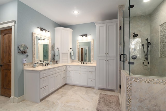 bathroom featuring vanity and a shower with shower door