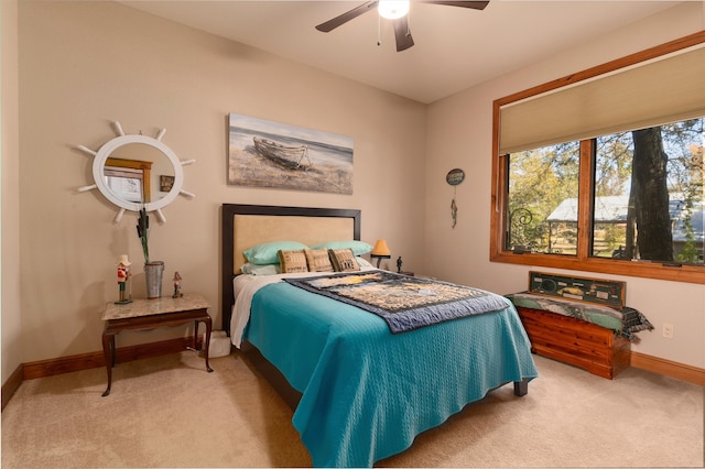 bedroom with light carpet and ceiling fan