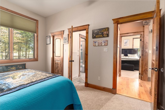 carpeted bedroom featuring ensuite bathroom