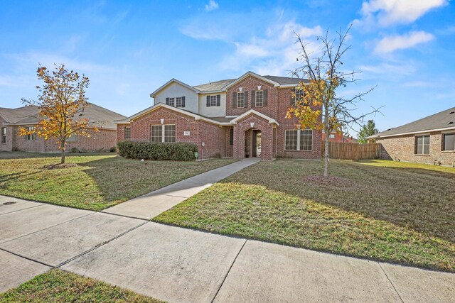 view of property featuring a front lawn