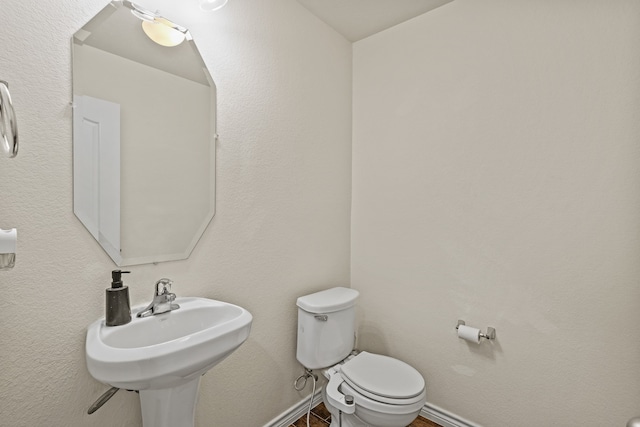 bathroom with toilet and sink