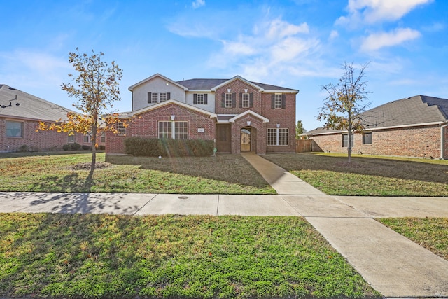 view of property featuring a front yard