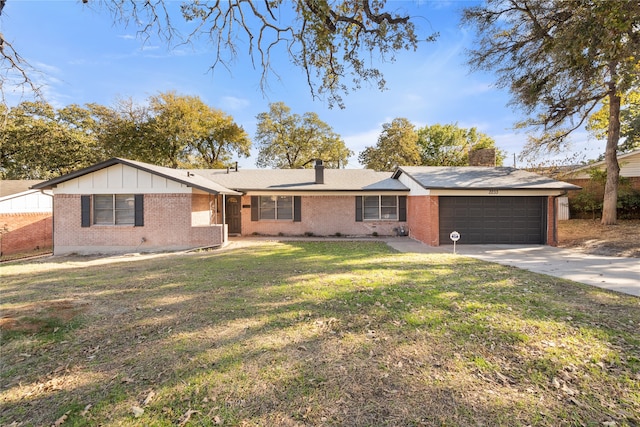 ranch-style home featuring a garage and a front lawn