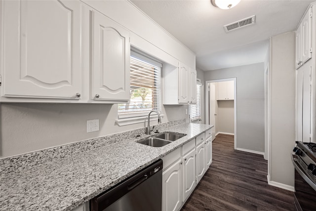 kitchen with dark hardwood / wood-style flooring, stainless steel appliances, white cabinetry, and sink