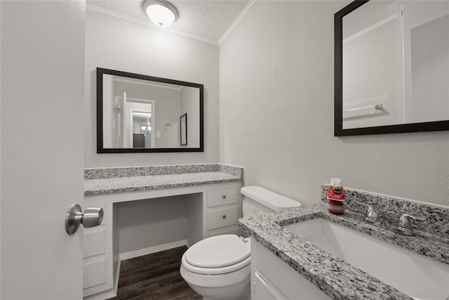 bathroom with vanity, toilet, wood-type flooring, and ornamental molding