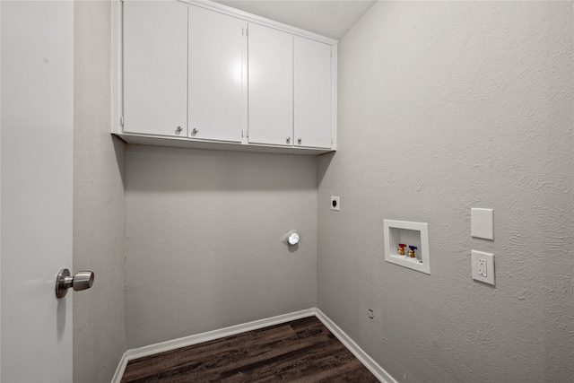 clothes washing area featuring cabinets, hookup for an electric dryer, dark hardwood / wood-style flooring, and hookup for a washing machine