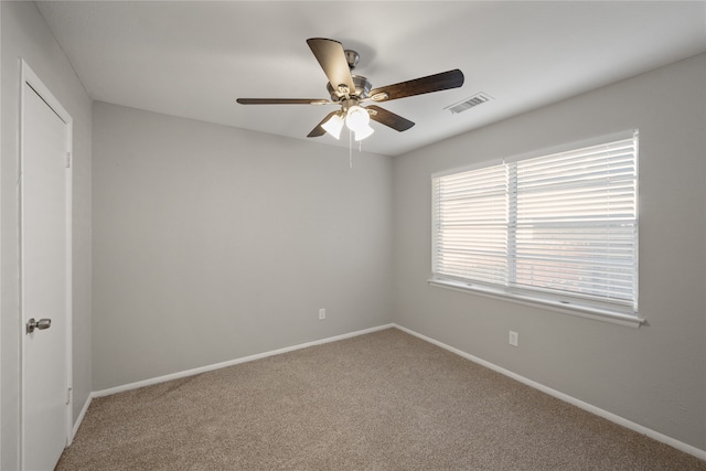 unfurnished room with carpet floors and ceiling fan