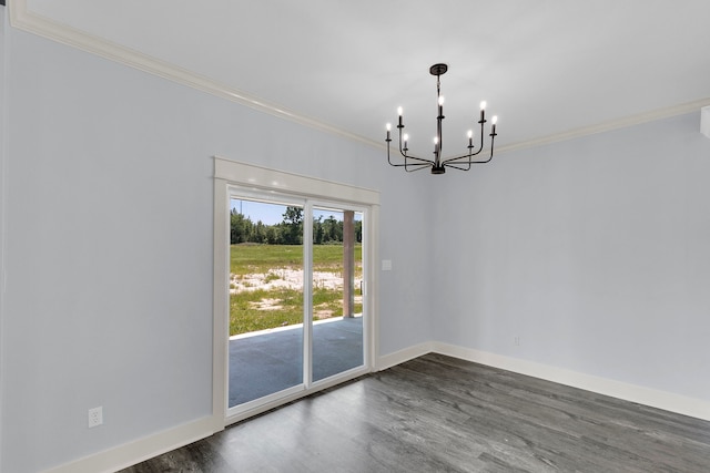 unfurnished dining area featuring crown molding, a chandelier, and dark hardwood / wood-style floors