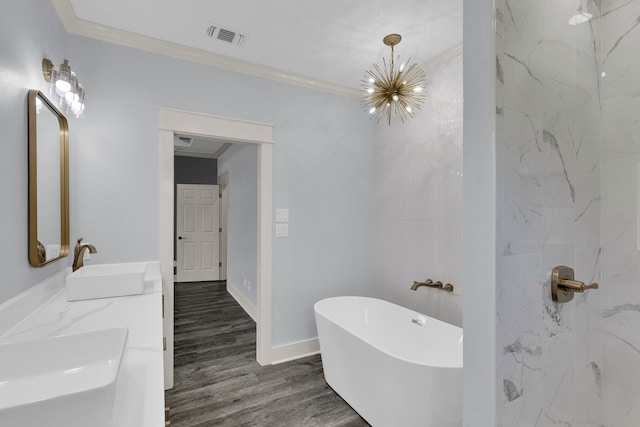 bathroom featuring a notable chandelier, crown molding, wood-type flooring, vanity, and independent shower and bath