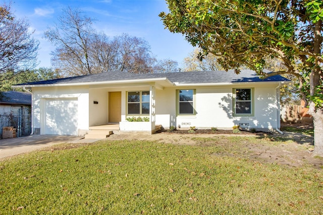 view of front of house featuring covered porch, a front yard, and a garage