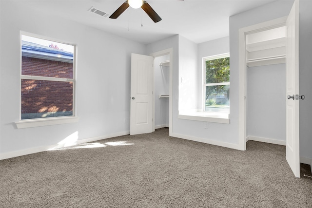 unfurnished bedroom with carpet floors and ceiling fan