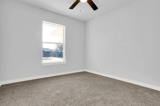 empty room with carpet floors and ceiling fan