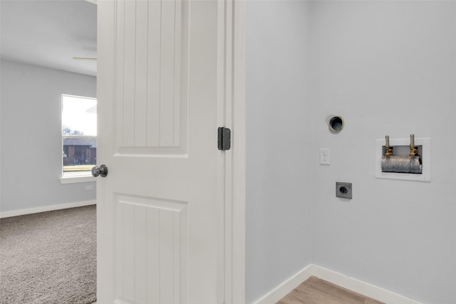 laundry room featuring light colored carpet, hookup for a washing machine, and electric dryer hookup