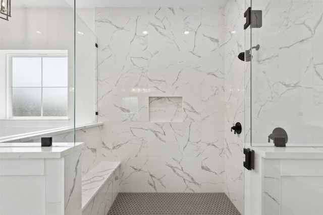 bathroom with a tile shower