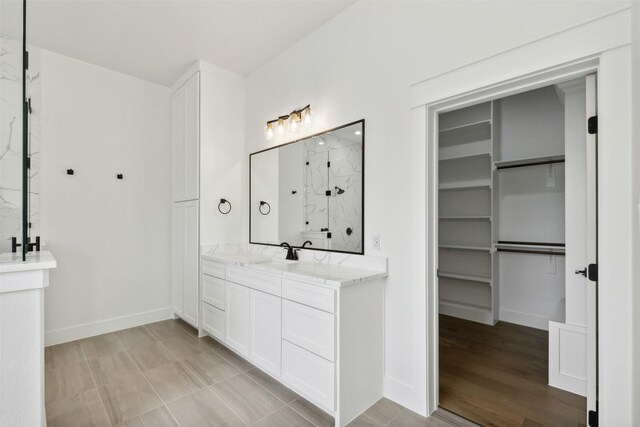 spacious closet featuring light hardwood / wood-style floors