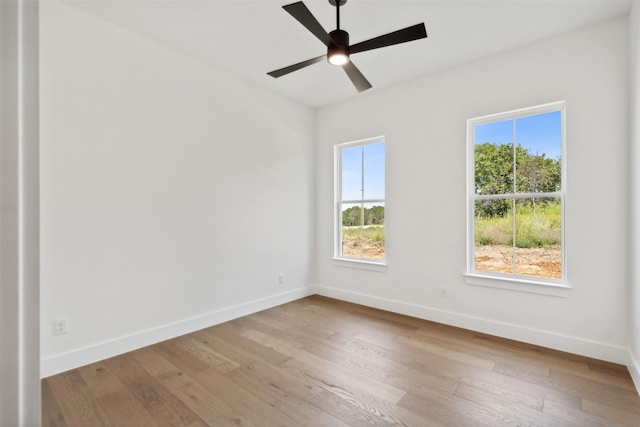 unfurnished room with ceiling fan and light hardwood / wood-style flooring