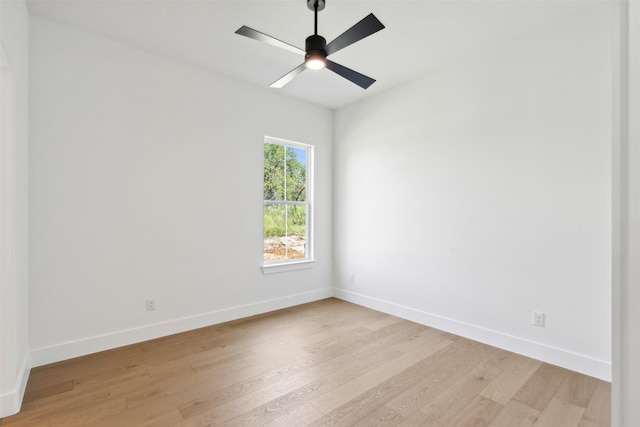 empty room with ceiling fan and light hardwood / wood-style floors