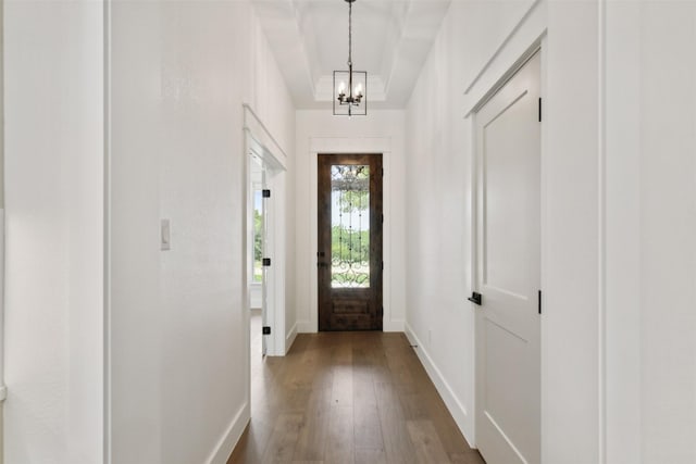 interior space featuring a notable chandelier and hardwood / wood-style flooring