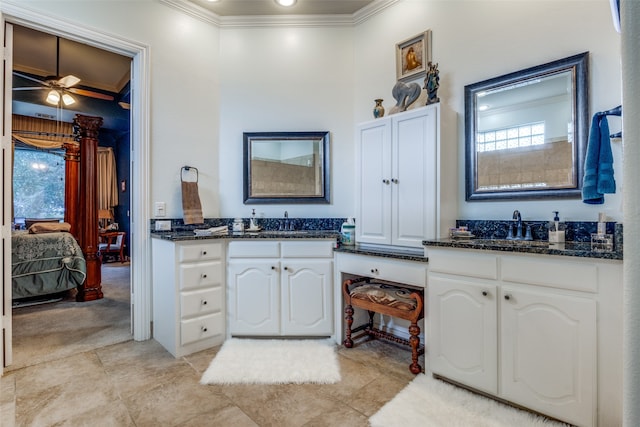 bathroom featuring tile patterned flooring, vanity, ceiling fan, and ornamental molding